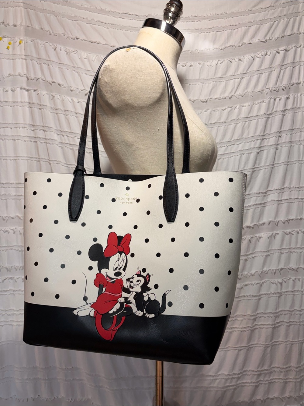 Disney x Kate Spade polka dot reversible tote bag with Minnie Mouse.